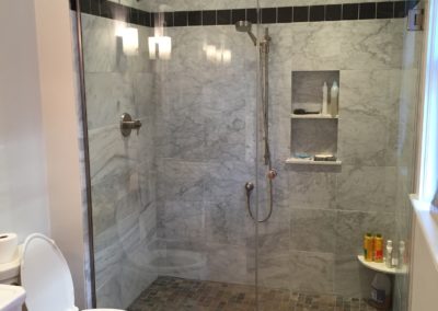 Marble tiling in new shower stall design.
