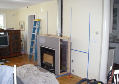 Frame made, blueboard on front, chimney connected