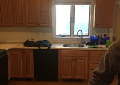 Kitchen before, old cabinets toward sink window